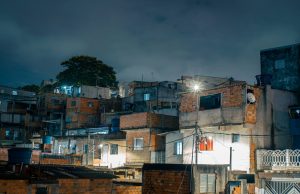 Anitta Funds Favela Projects in Rio Childhood Neighborhood Anitta performing on stage with colorful lights, representing her global music career rooted in Rio's north zone