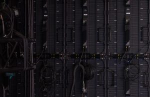 Anthropic Refuses Pentagon Demand on AI Weapons Ban A Claude AI chatbot interface on a screen with a gavel and legal documents nearby, symbolizing the legal dispute over AI weapons restrictions.