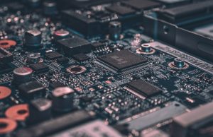 Nvidia Names Blackwell GPU Architecture After Mathematician Nvidia CEO Jensen Huang presents the Blackwell GPU architecture on stage at GTC 2024, with a large screen displaying the chip design behind him.