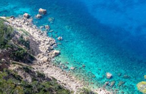27 Migrants Die as Boats Capsize off Tunisia’s Kerkennah Rescue workers pull survivors from rough seas beside a capsized wooden boat off low-lying Kerkennah Islands.