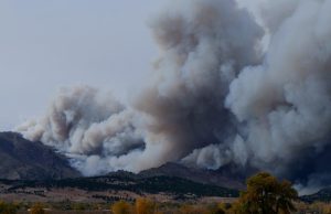 Wildfire Death Toll Hits 24 as Search Continues Search and rescue teams walk through charred forest debris and burned homes after a deadly wildfire