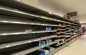 WFP Gaza Food Stocks Empty, Aid Kitchens to Run Out in Days Empty shelves in a World Food Programme warehouse in Gaza, with no grain or cooking oil visible, highlighting the humanitarian crisis.