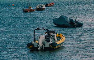 Mahdia Boat Sinking Leaves 40 Migrants Dead, 30 Rescued Rescue workers carry a survivor from the waves as recovered bodies line Mahdia’s dock after the migrant boat sank.