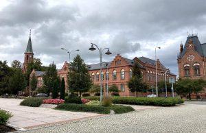 Train-Truck Collision in Czech Republic Kills 1, Injures 19 Emergency responders at a train-truck collision site in BohumÃn, Czech Republic, with damaged vehicles and rescue crews working.