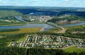 Wildfires Force 6,000 Evacuations in Fort McMurray Smoke billows from a boreal forest wildfire near Fort McMurray, Alberta, as evacuation vehicles line a highway.