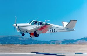 Pennsylvania Plane Crash Kills 5 in Retirement Community A Beechcraft Bonanza aircraft wreckage in a residential area with emergency responders surrounding the crash site.