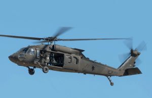 Four Soldiers Killed in Washington Black Hawk Crash A Sikorsky UH-60 Black Hawk helicopter in flight over a forested area, similar to the one that crashed near Summit Lake.