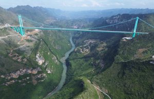 Huajiang Canyon Bridge Opens 625m Above Beipan River Alpine suspension bridge soars 625 meters above a misty Guizhou canyon as the first cars cross the new record-setting span.