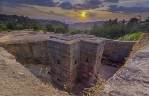 Ethiopia Church Collapse Kills 36, Injures 200 Rescue workers search through rubble of a collapsed church building in Areti, Amhara Region, Ethiopia, as dust rises from the debris.