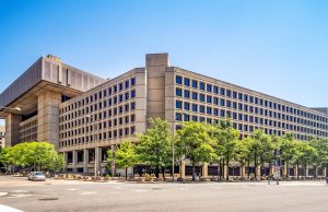 FBI Releases 2026 UAP Photo A7 to AARO Grainy government UAP image with central crosshair and bright circular object above darker background.