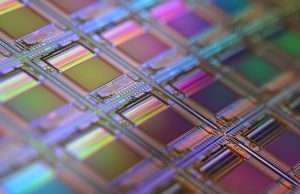 Intel Invests €80B in European Chip Production Intel CEO Pat Gelsinger announces a multi-billion euro semiconductor investment plan from a London stage, with European Union flags in the background.