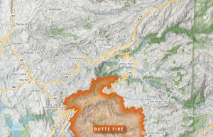 Park Fire Burns 350,000 Acres in Northern California Aerial view of the Park Fire raging through forested hills in Northern California, with smoke billowing over the landscape.