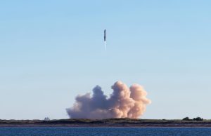 SpaceX Starship Flight 9 Tests Booster Reflight SpaceX Starship launches from Texas site at dusk with bright exhaust plume against sky